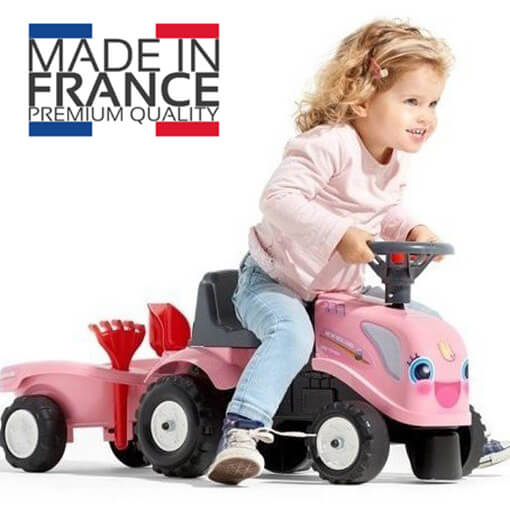 Traktor guralica za devojčice roze boje sa prikolicom, grabuljicom i lopaticom