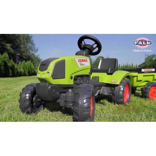 Traktor sa prikolicom Claas 1040ab na pedale zeleni na travi